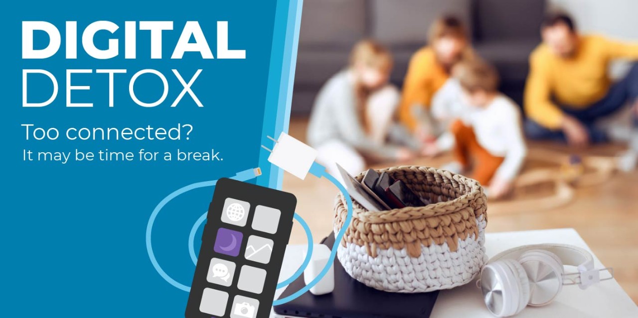 Digital Detox. Phones in basket while family plays together.